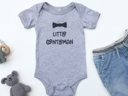 Gray baby bodysuit with the text Little Gentleman