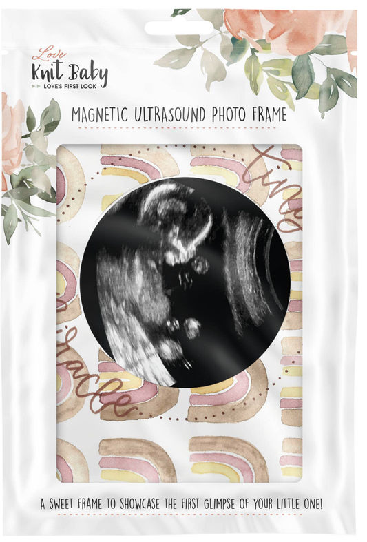 Baby ultrasound photo in a frame with a rainbow design and the text tiny miracle