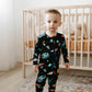 baby boy wearing baby bamboo pajamas romper in black with outer space print