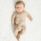 baby boy wearing taupe woodland print baby bamboo pajamas romper