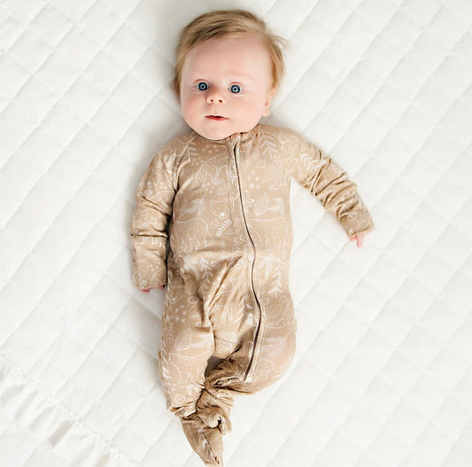 baby boy wearing taupe woodland print baby bamboo pajamas romper