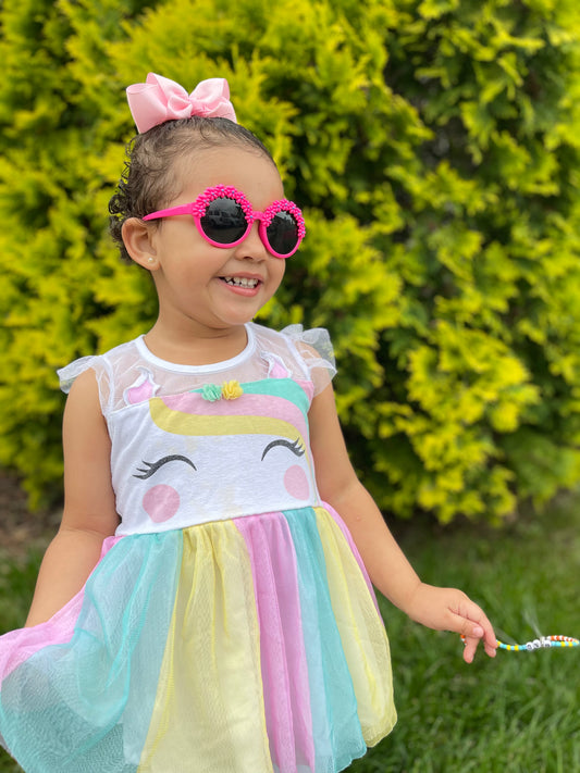 Toddler girl wearing pink flower toddler sunglasses