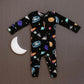 baby boy wearing baby bamboo pajamas romper in black with outer space print