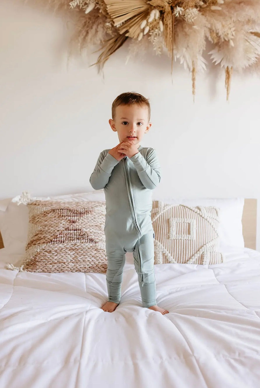 baby boy wearing agave baby bamboo pajamas romper
